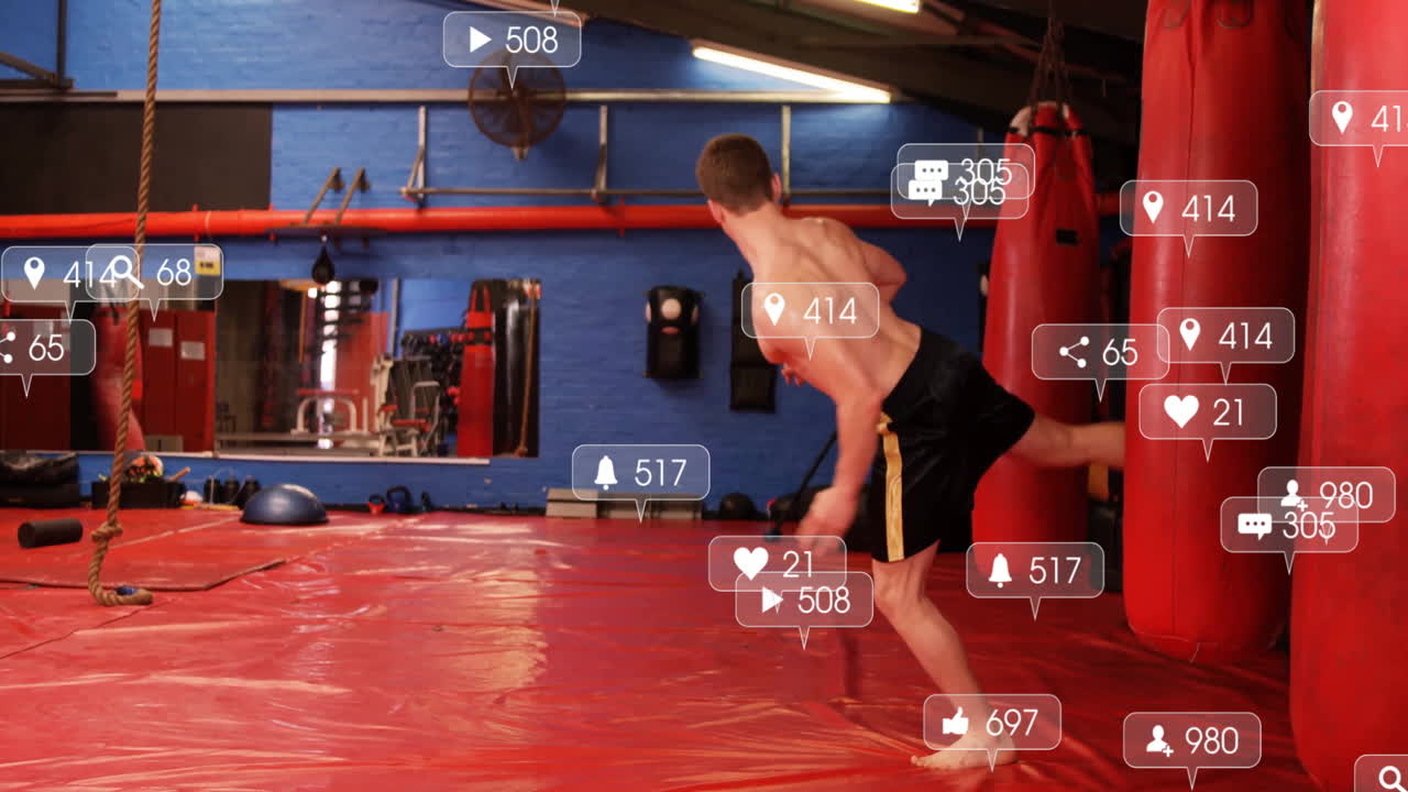 Practicing martial arts in gym, man with animation of social media icons