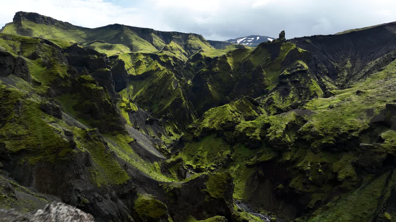 Hiker on the Fimmvörðuháls trail and the nature around, drone fly over, Iceland