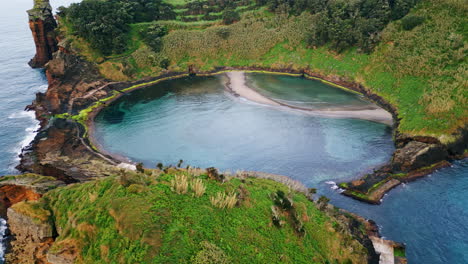 rocky island lagoon drone shot. picturesque coastline at green nature landscape