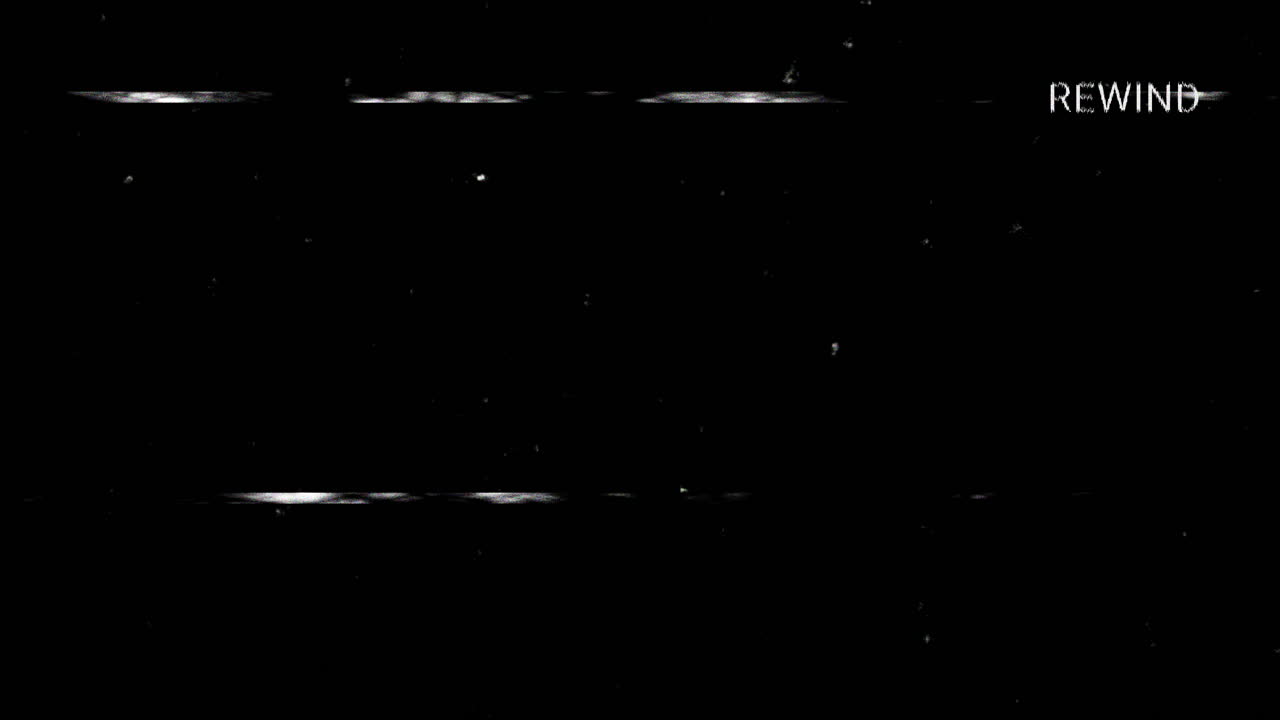 VHS Rewind Effect with Static and Glitches on Black Screen