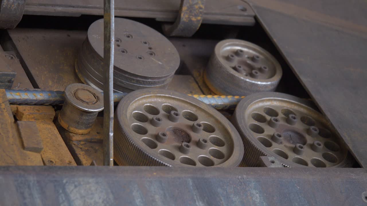 Close-up view about a working iron machine cutter and its mechanical movement.