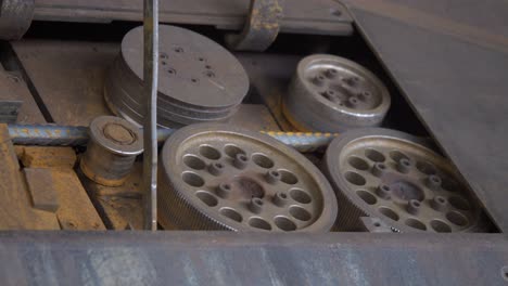 close-up view about a working iron machine cutter and its mechanical movement.