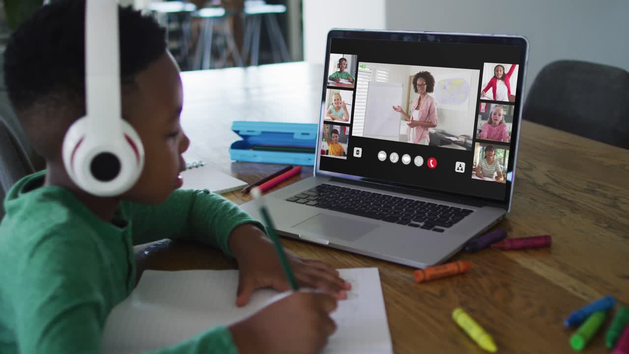 Composite video of boy using laptop with interface of diverse class and teacher in online lesson