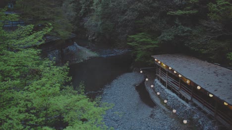 ryokan, traditional japanese inn in the forest along the kiyotaki river in japan. - static shot