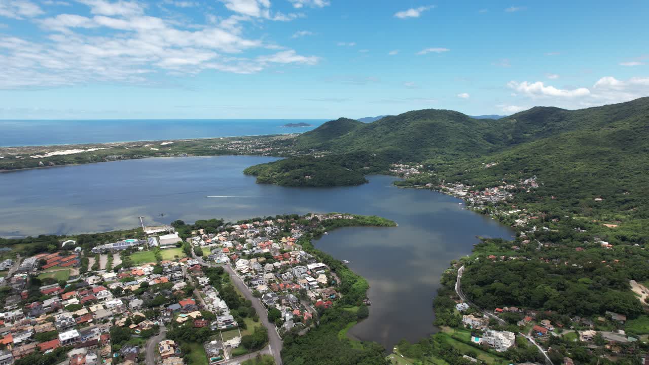 drone shot in beautiful landscape on santa catarina island, brazil, sunny day and magical light, blue sky