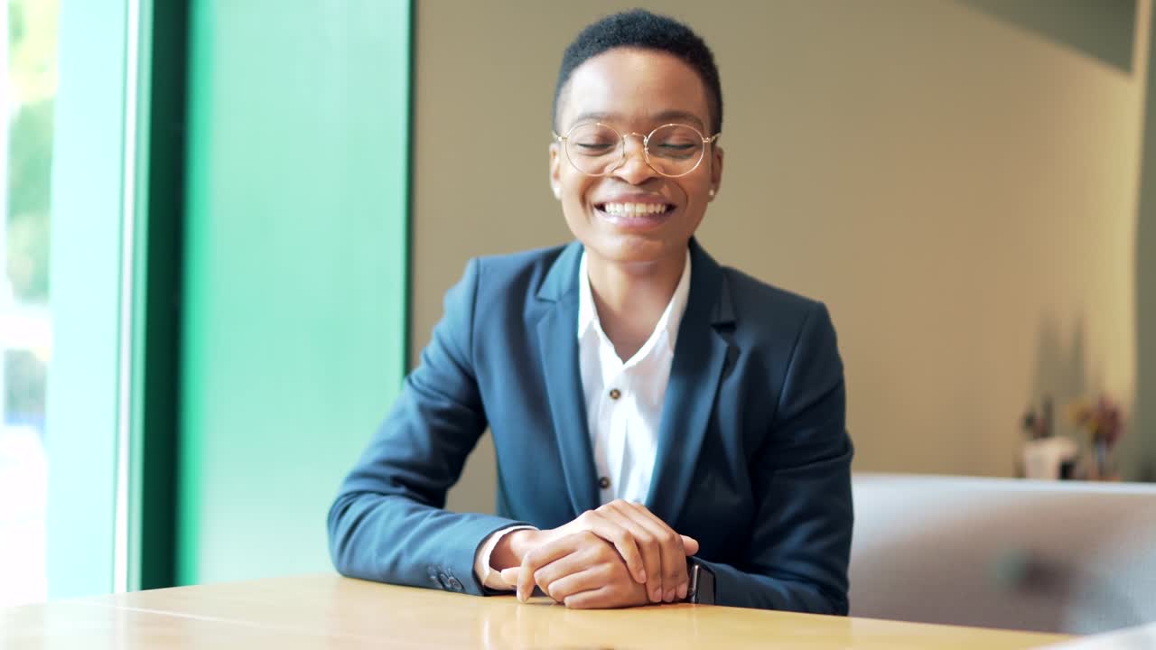 webcam view. African american businesswoman freelancer smiling and friendly talking while looking at camera