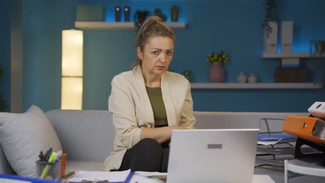 Home-office-worker-woman-looking-at-camera-with-fear-and-doubt.