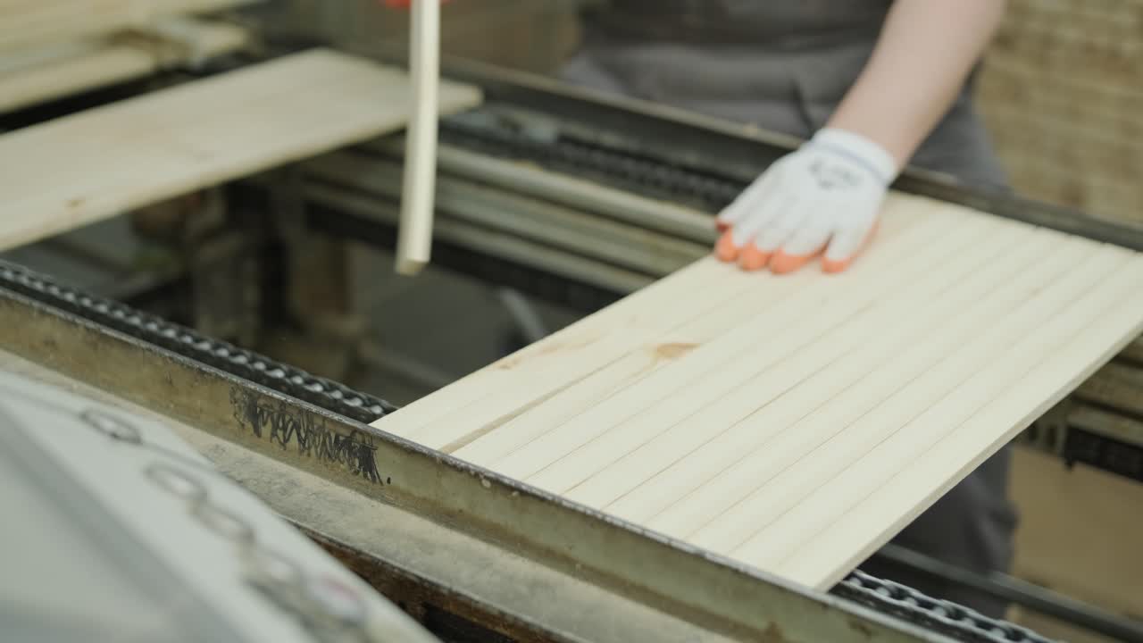 Worker's Hands in Gloves Assembling Wooden Slats on Production Line