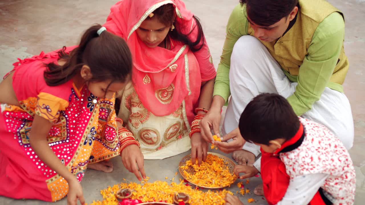 Parents with kids celebrate the Indian traditional festival of Diwali
