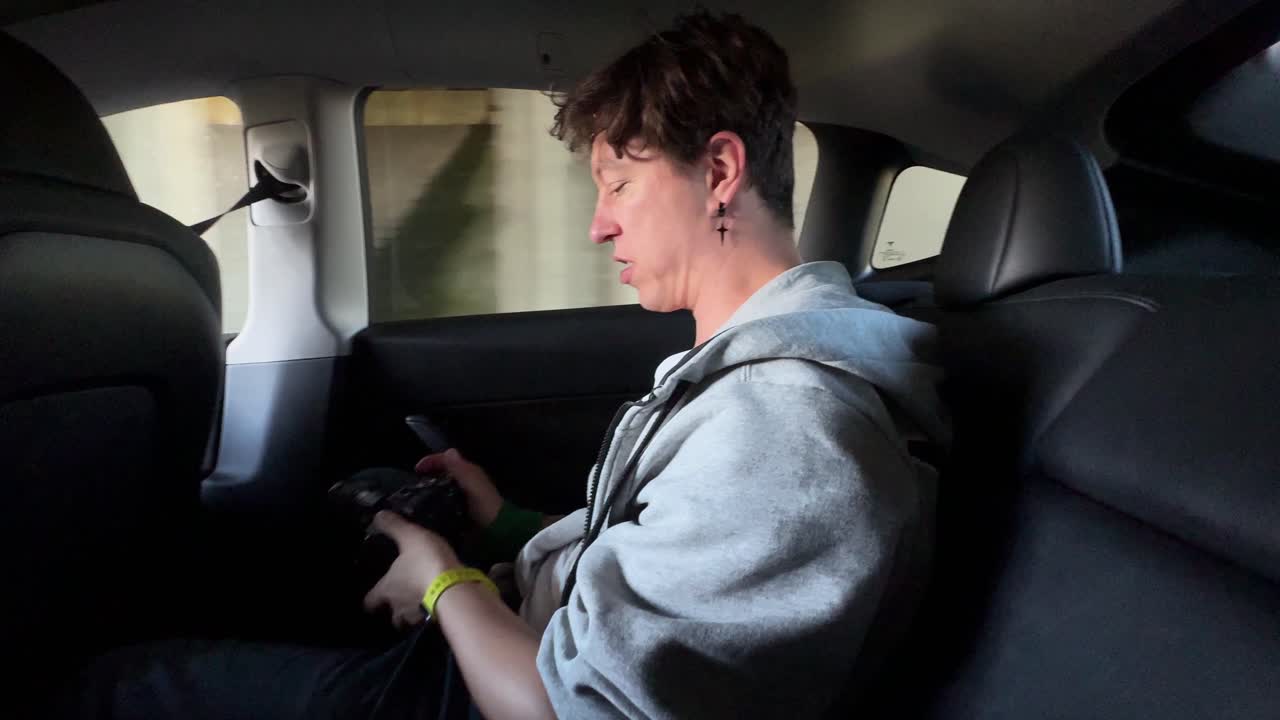 People driving in a Tesla Model 3