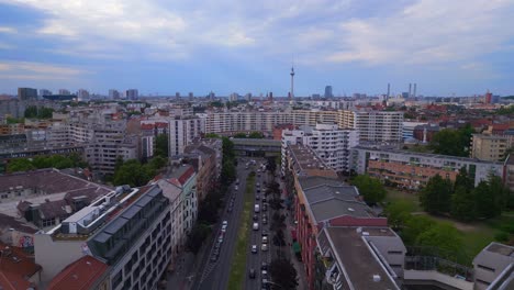 Wonderful-aerial-top-view-flight-City-Berlin-suburban-railroad-station-prefabricated-building-skyscrapers-district-Neukoeln,-Germany-Summer-day-2023