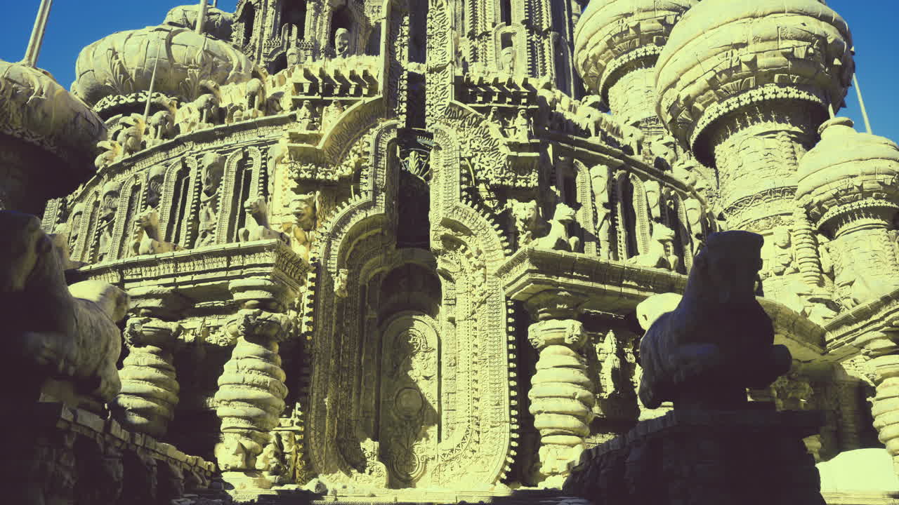 Intricate stone carvings at a historical temple in tranquil daylight