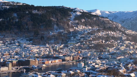 Aerial shot of the famous Bryggen and Mount Fløyen in Bergen at winter