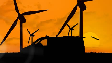 Animation-of-silhouetted-delivery-van-moving-over-wind-turbines-and-plane-taking-off-on-orange