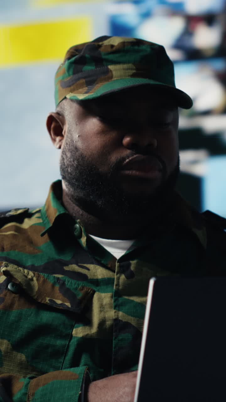 Close-up of a Serious Soldier in Camouflage Uniform Looking Around