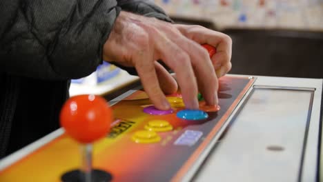 person playing arcade game