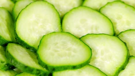 sliced pieces of green cucumber stacked on a hill