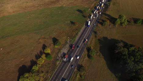 Drone-view-firefighter-fighting-car-fire-on-highway-after-road-accident