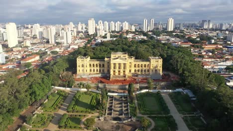 A-drone-shot-of-a-beautiful-museum-aka-Ipiranga-museum-after-its-restoration-and-modernization-with-a-beautiful-blue-clear-sky