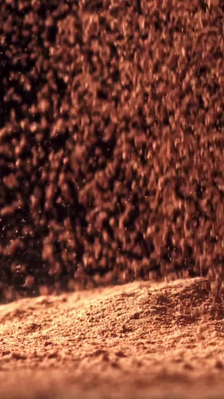 Fine Brown Powder Falling and Accumulating on a Dark Surface