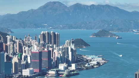 4k tele zoom view of hong kong central district - slow pan aerial view angle from sky.