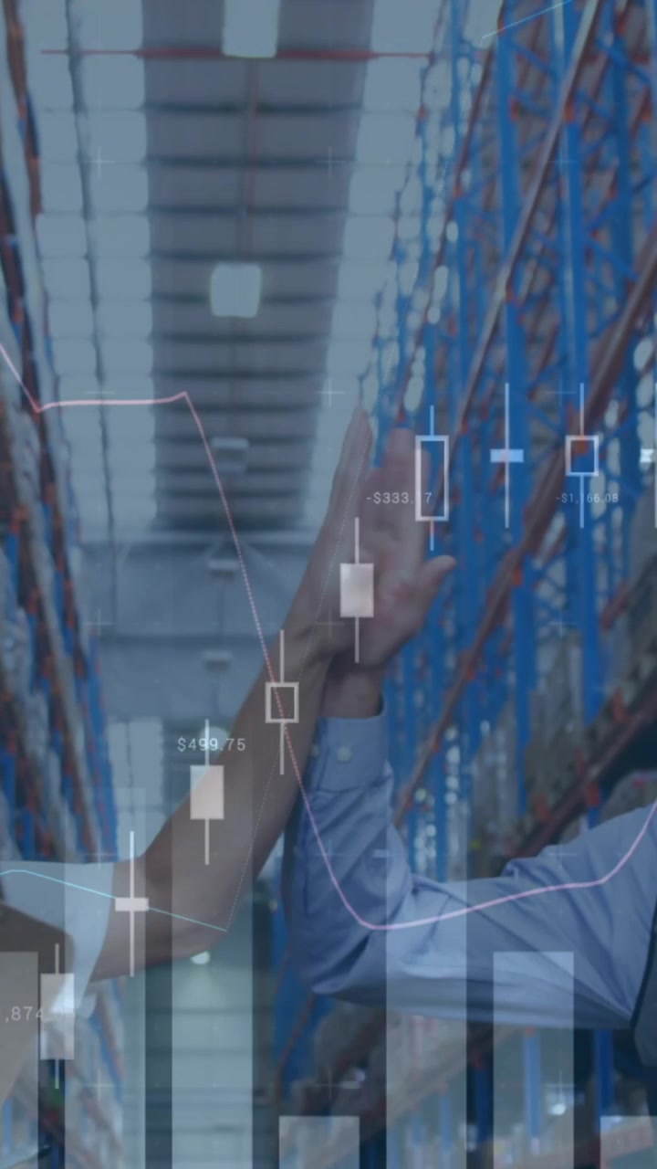 Animation of financial graphs over happy diverse female and male warehouse workers