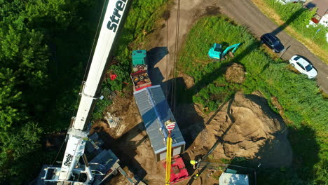 tall crane, rising drone shot on construction site