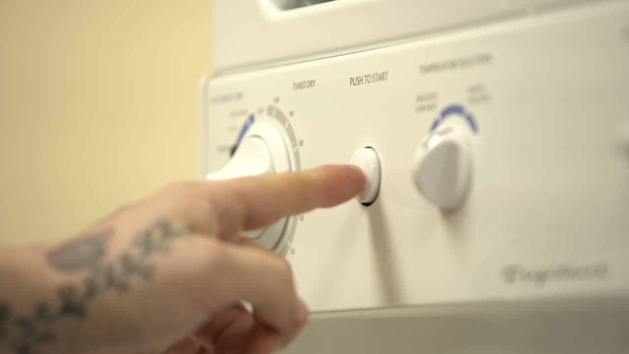 adjusting temperature and settings for laundry