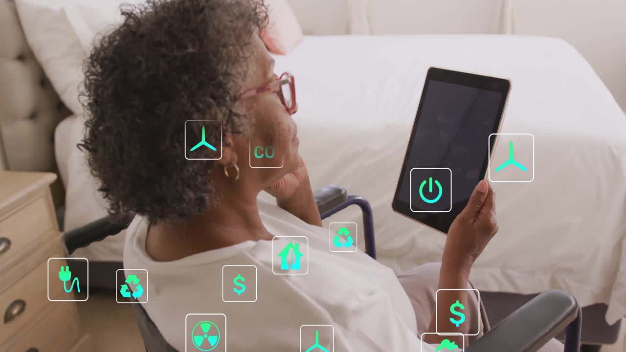Using tablet with animation of digital icons, elderly woman managing smart home
