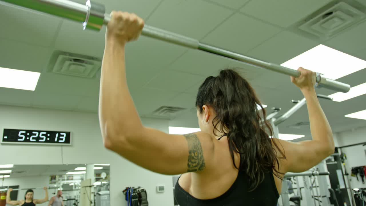 Active motivated female athlete training in gym