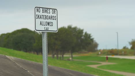 no bikes skateboards sign park warning