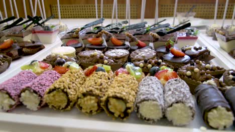 Wedding-table-with-appetizing-sweets-and-cakes