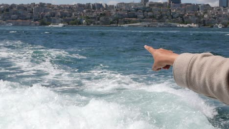pointing at istanbul city from a ferry