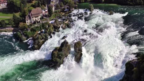 aerial shots - rhine fall, the largest waterfall in europe near schaffhausen switzerland 4k by drone over the rhine