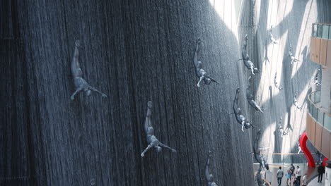 dubai mall's amazing waterfall with sculptures
