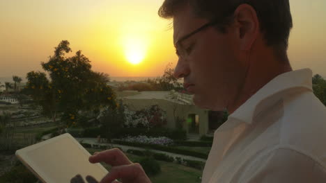 work on business with pad outdoor at sunset