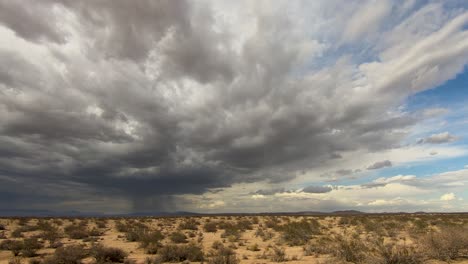 timelapse of dark storm clouds gathering in mojave desert grasslands