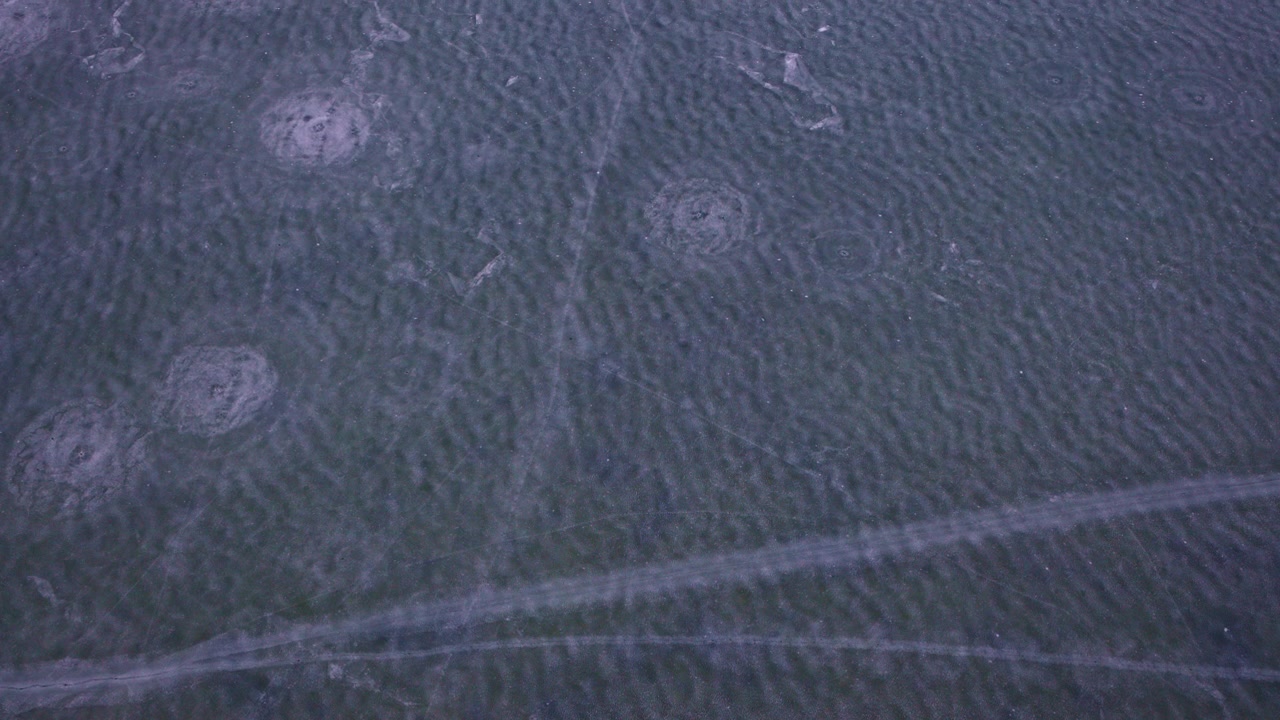 Aerial footage capturing frozen ice formations from above on the Great Lakes