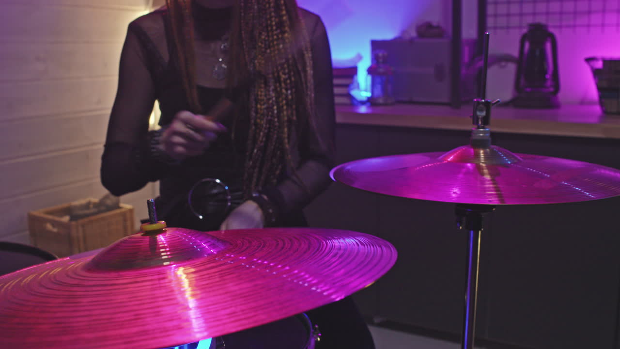 Female Drummer Performing Music At Concert