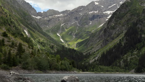 smooth zoom in from a wide angle view of lauvitel lake to the detail of the perma snow from the glacier