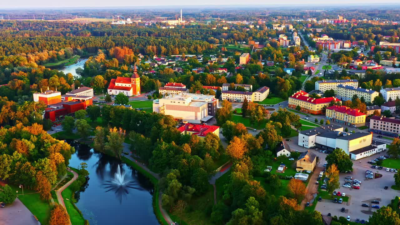 Colorful Aerial View of Valmiera With Green Parks, Buildings, and Pond Fountain in Autumn