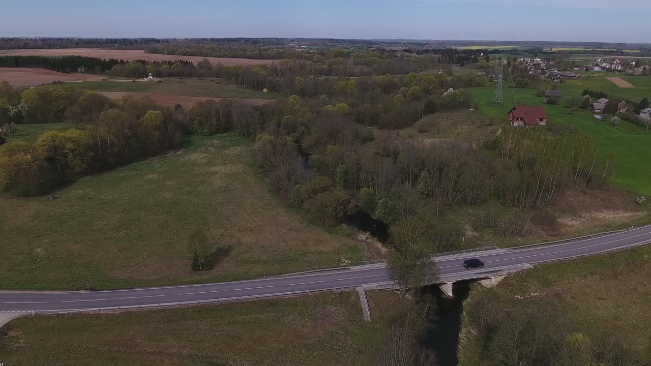 Bridge Over the River in Musninkai, Lithuania. 4K Aerial