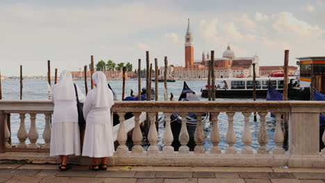 two nuns admire view of venice