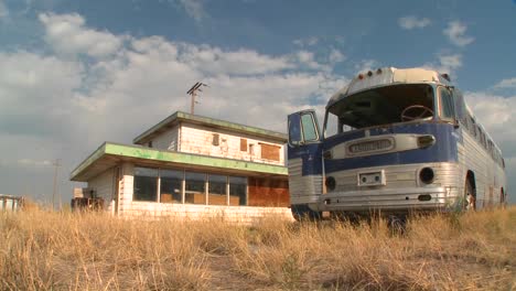 time lapse of an abandoned greyhound bus in a field