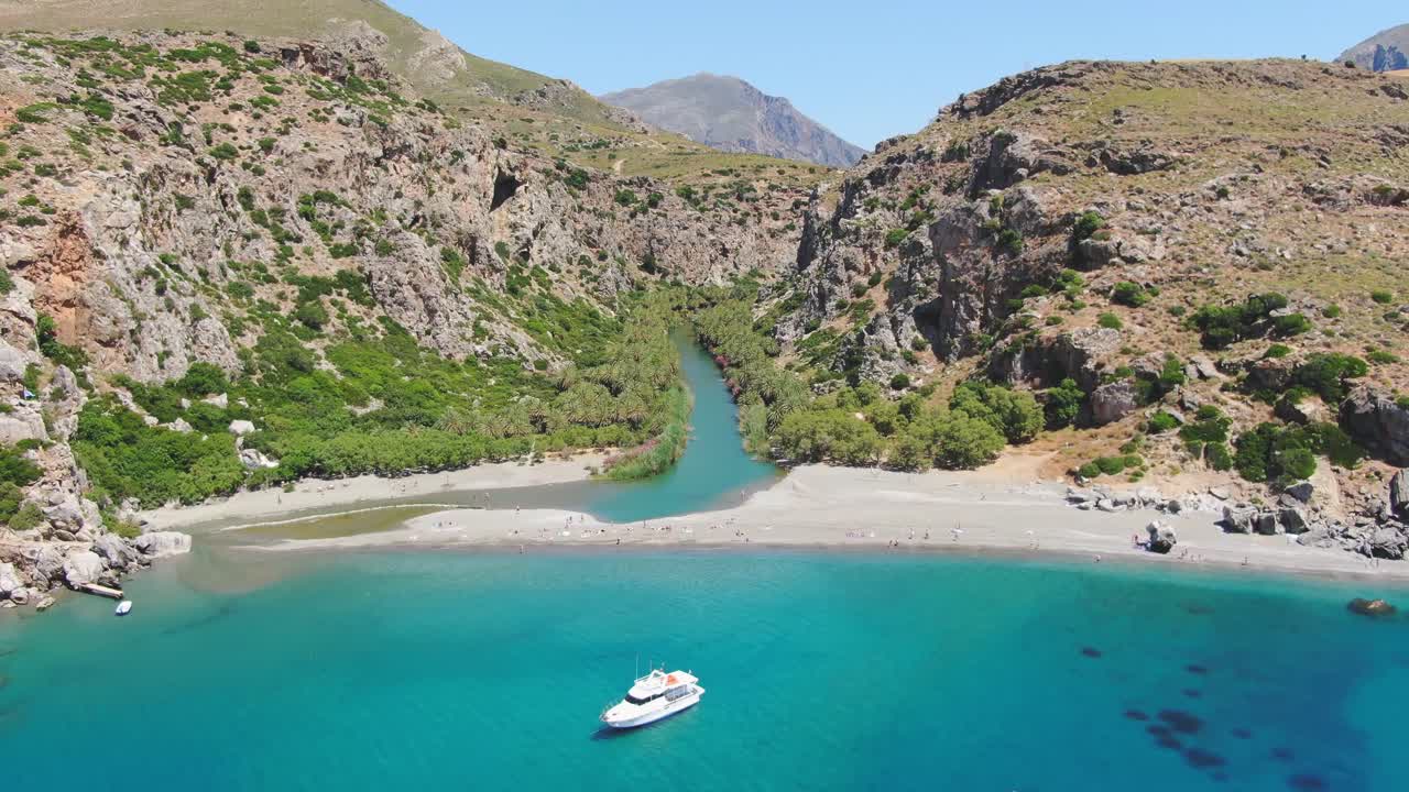 Aerial drone shot of iconic river and beach of Preveli in Southern Rethimno, Crete Island, Greece