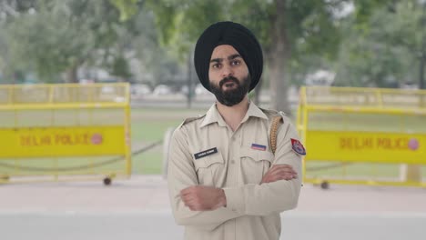 angry sikh indian police man looking at someone