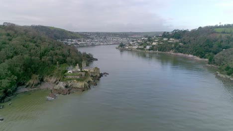 Aerial-tracking-forward-up-the-mouth-of-the-river-Dart