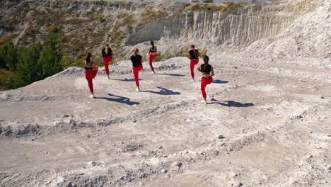 group of women dancing in a quarry