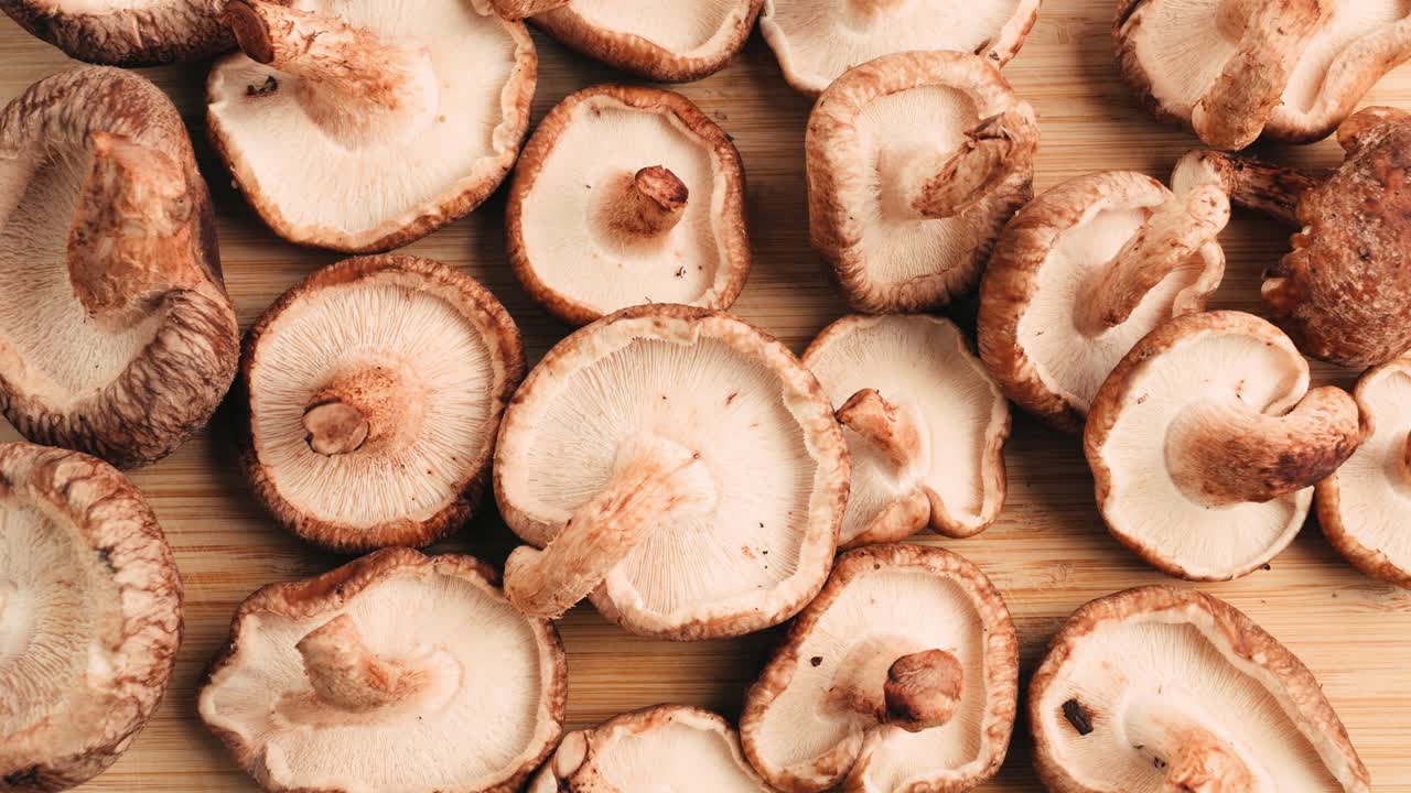 Freshly Sliced Shiitake Mushrooms on a Wooden Cutting Board