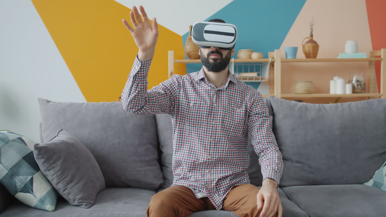 Man Experiencing Virtual Reality Headset at Home